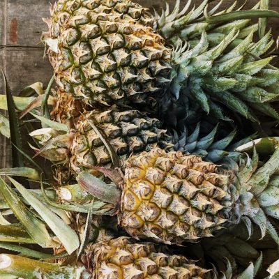 Thorny pineapples closeup in the market